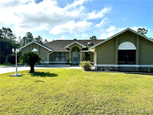 3150 W Mustang Blvd, Beverly Hills, FL 34465 - ranch-style house with stucco siding and a front lawn
