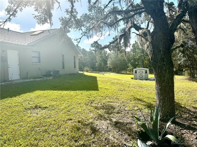 3150 W Mustang Blvd, Beverly Hills, FL 34465 - view of green lawn featuring cooling unit