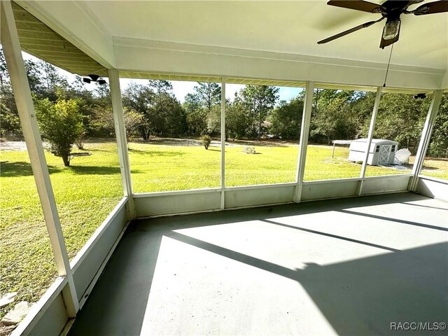 3150 W Mustang Blvd, Beverly Hills, FL 34465 - unfurnished sunroom with a ceiling fan, healthy amount of natural light, and view of scattered trees
