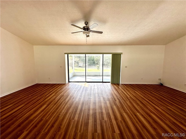 unfurnished room featuring a textured ceiling, ceiling fan, and dark hardwood / wood-style floors