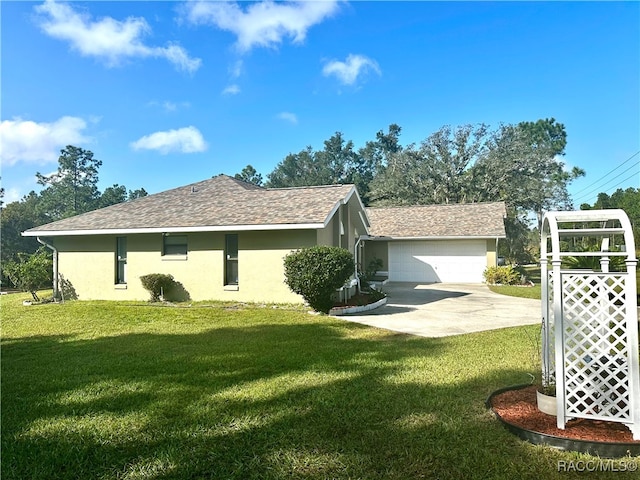 view of property exterior featuring a garage and a lawn