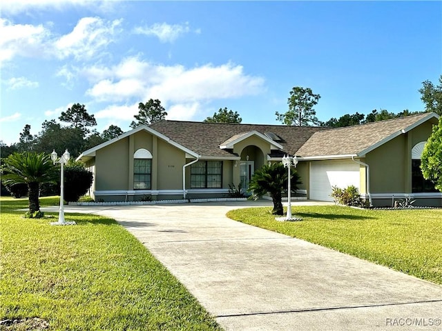3150 W Mustang Blvd, Beverly Hills, FL 34465 - single story home with stucco siding, concrete driveway, a front yard, a garage, and a shingled roof
