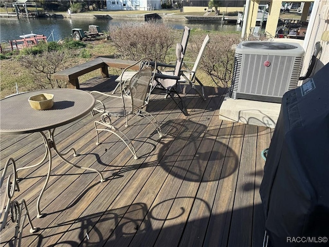 deck featuring a water view and central AC