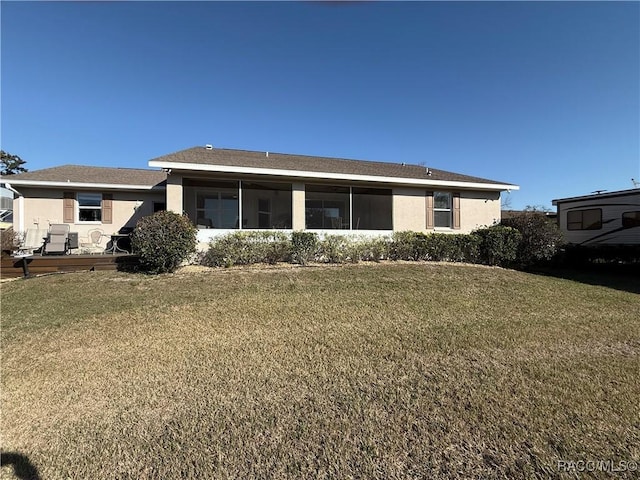 rear view of house with a lawn