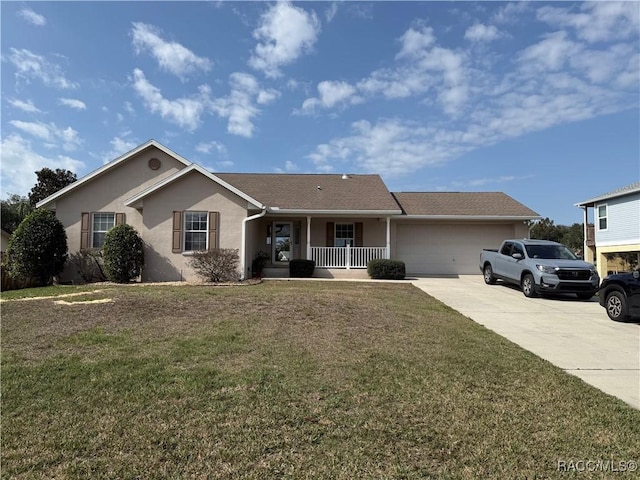 ranch-style home featuring a garage, a front lawn, and a porch