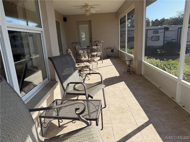 sunroom / solarium with ceiling fan