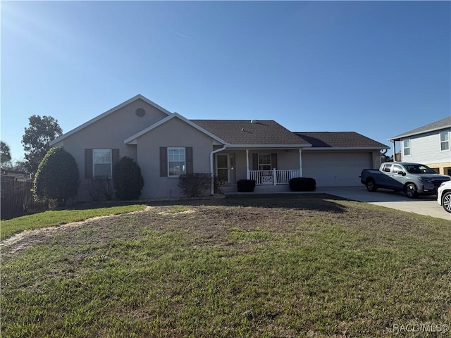 3926 N Eagle Pt, Crystal River, FL 34428 - single story home featuring a porch, a garage, concrete driveway, and a front lawn