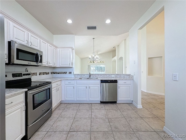 kitchen featuring appliances with stainless steel finishes, sink, and white cabinets