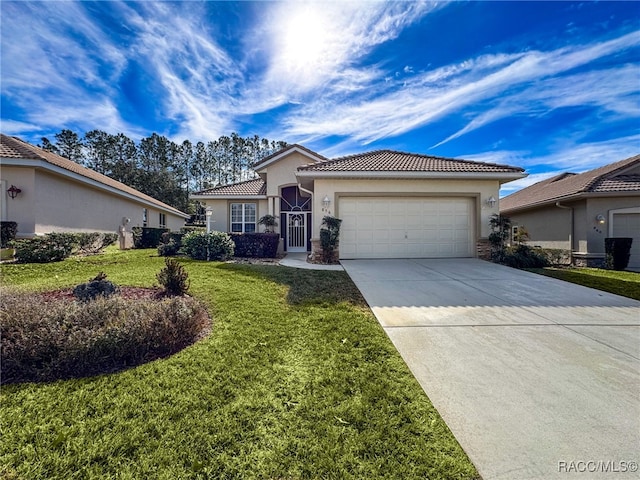 view of front of home featuring a garage and a front lawn