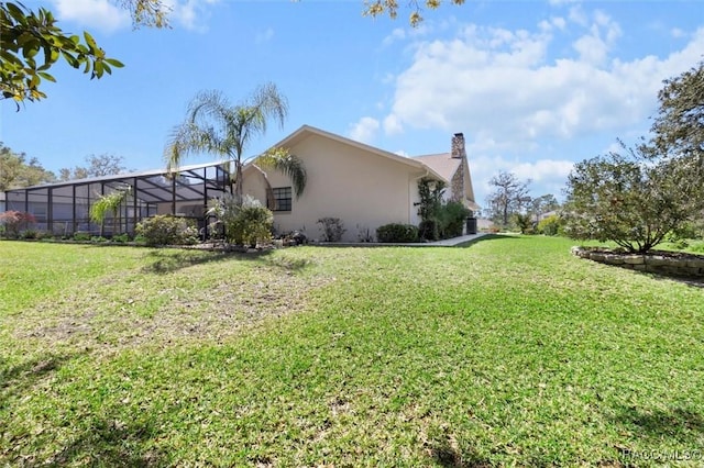 view of yard with a lanai