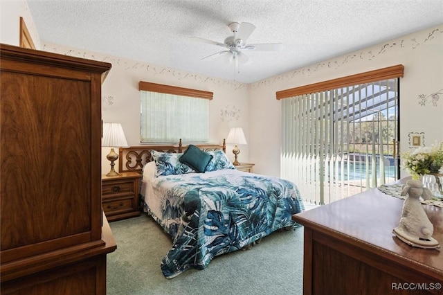 carpeted bedroom with access to exterior, a ceiling fan, and a textured ceiling