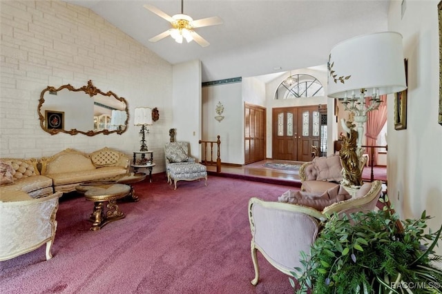 living room featuring lofted ceiling, carpet, and ceiling fan