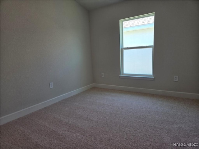 1280 Heron Point Dr, Inverness, FL 34453 - spare room featuring baseboards and light colored carpet
