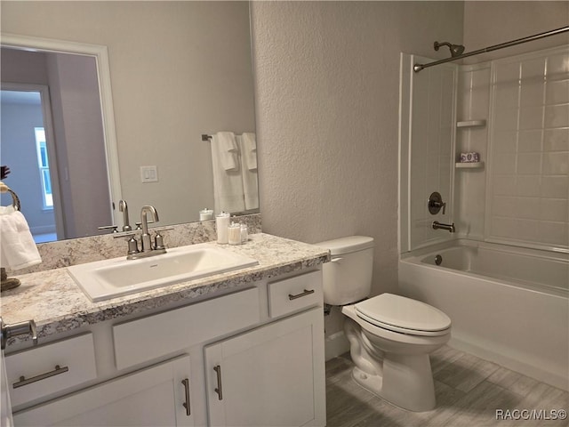 1280 Heron Point Dr, Inverness, FL 34453 - bathroom featuring a textured wall, shower / bath combination, vanity, and toilet
