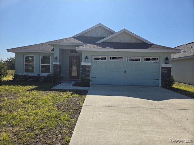 1280 Heron Point Dr, Inverness, FL 34453 - view of front of house featuring stone siding, concrete driveway, a front yard, and a garage