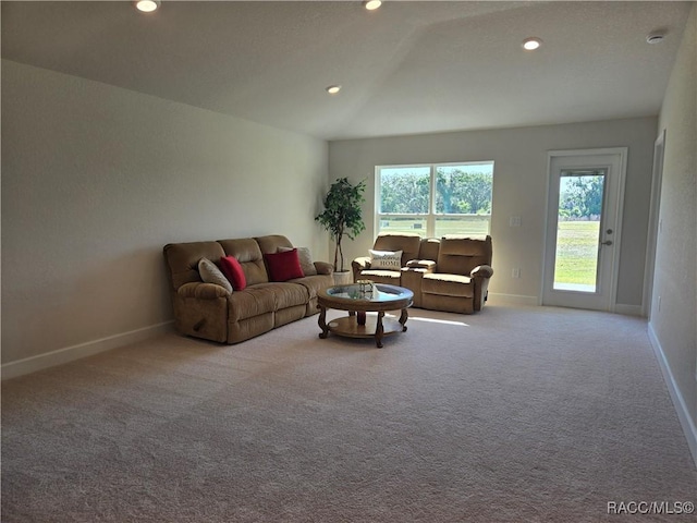 1280 Heron Point Dr, Inverness, FL 34453 - living room with lofted ceiling, baseboards, carpet floors, and recessed lighting