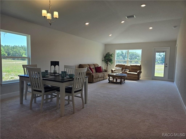 1280 Heron Point Dr, Inverness, FL 34453 - carpeted dining space with vaulted ceiling, baseboards, visible vents, recessed lighting, and a chandelier