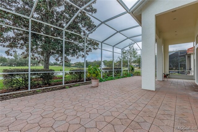 1095 W Skyview Landings Dr, Hernando, FL 34442 - view of patio / terrace featuring glass enclosure and a water view