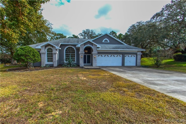 ranch-style house with a front yard and a garage