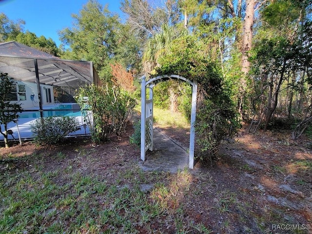 view of yard with a lanai