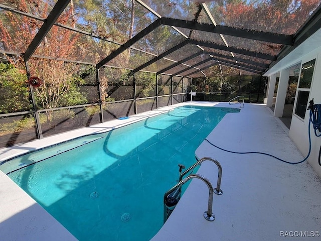 view of pool featuring a lanai