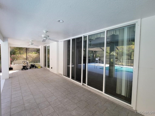 view of patio with ceiling fan