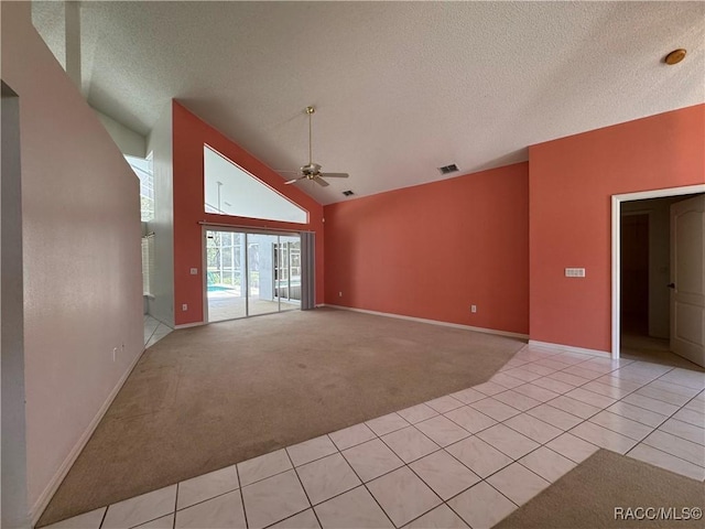 unfurnished living room featuring light colored carpet, a textured ceiling, ceiling fan, and visible vents
