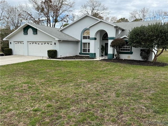 single story home with a shingled roof, an attached garage, a front lawn, stucco siding, and driveway