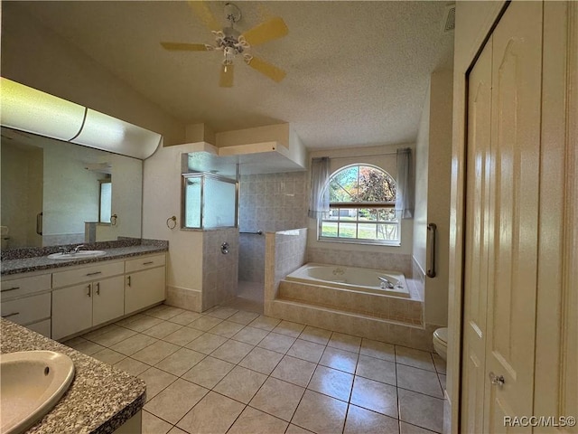 full bathroom with a tile shower, tile patterned flooring, vanity, a ceiling fan, and a bath