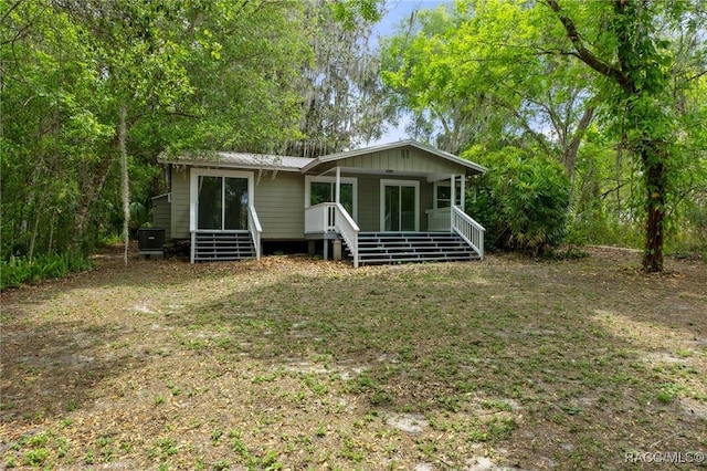 3184 N Edward Island Pt, Hernando, FL 34442 - view of front of house featuring covered porch and stairway