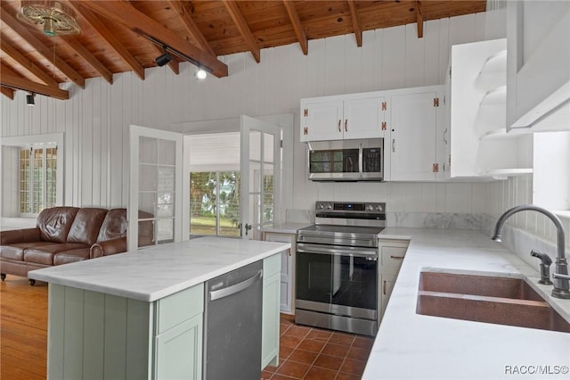 3184 N Edward Island Pt, Hernando, FL 34442 - kitchen with stainless steel appliances, a sink, wooden ceiling, white cabinetry, and a kitchen island