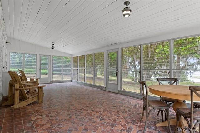 3184 N Edward Island Pt, Hernando, FL 34442 - sunroom featuring lofted ceiling, wood ceiling, stone floors, and outdoor dining area