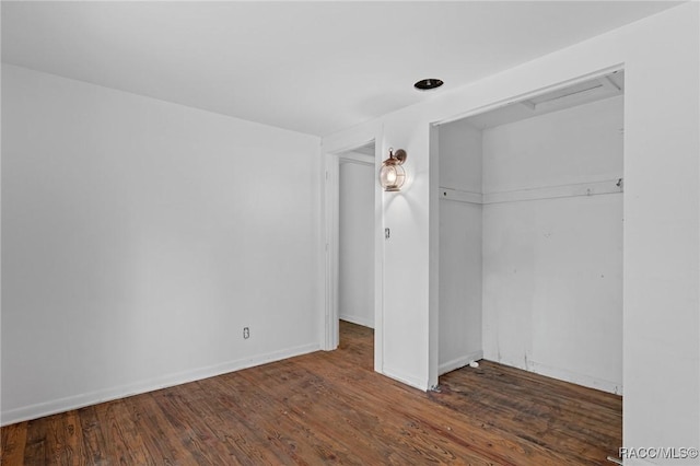 3184 N Edward Island Pt, Hernando, FL 34442 - unfurnished bedroom featuring a closet, wood finished floors, and baseboards