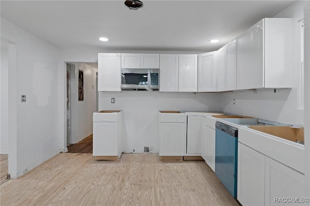 3184 N Edward Island Pt, Hernando, FL 34442 - kitchen featuring stainless steel microwave, dishwasher, light wood-style flooring, white cabinets, and recessed lighting