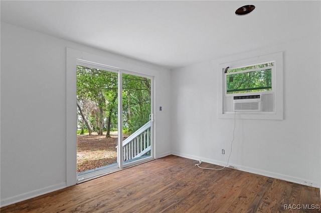 3184 N Edward Island Pt, Hernando, FL 34442 - empty room with wood finished floors, baseboards, and cooling unit