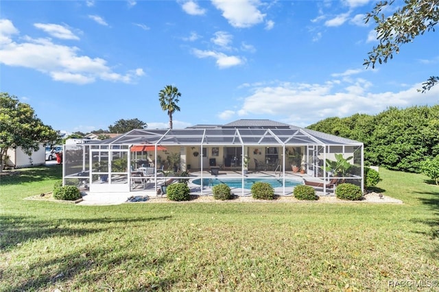 exterior space with a lawn and glass enclosure