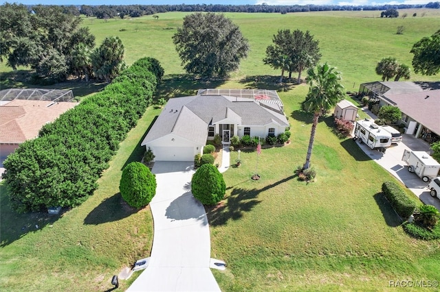 birds eye view of property with a rural view