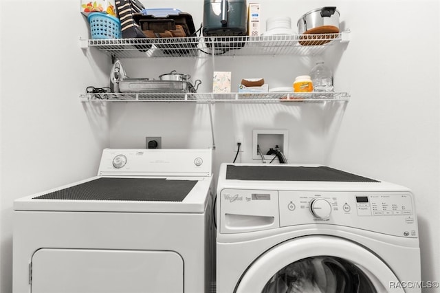 laundry room featuring washing machine and clothes dryer