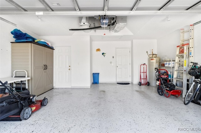 garage with electric water heater and a garage door opener