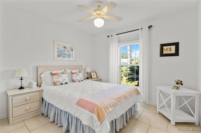 tiled bedroom with ceiling fan