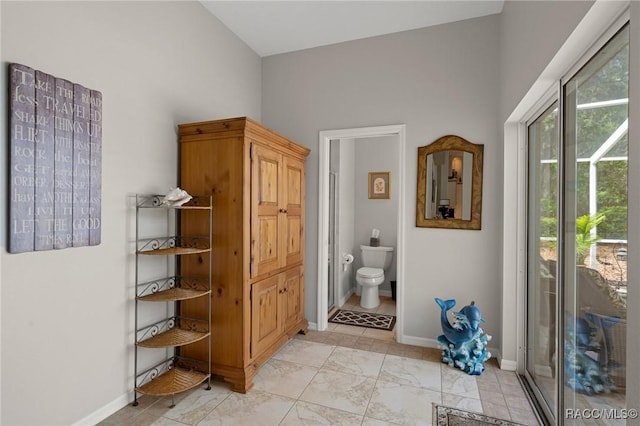 4198 N Longvalley Rd, Hernando, FL 34442 - full bath with toilet, high vaulted ceiling, and baseboards