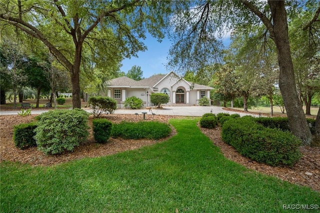 4198 N Longvalley Rd, Hernando, FL 34442 - single story home with a front yard and stucco siding