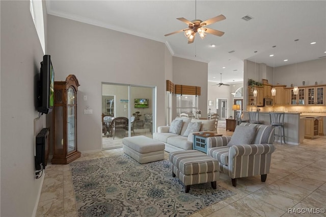 4198 N Longvalley Rd, Hernando, FL 34442 - living room with visible vents, ceiling fan, ornamental molding, and a high ceiling