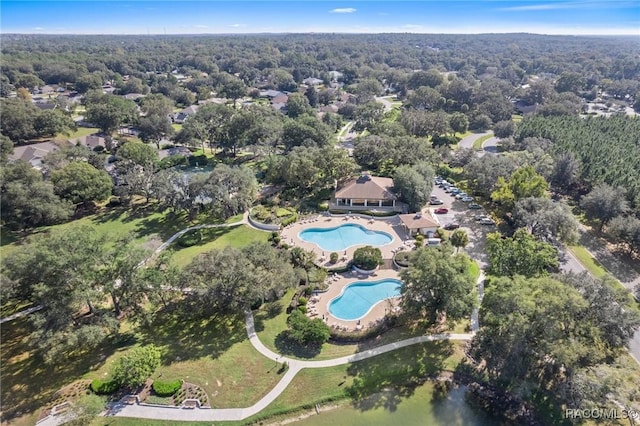 drone / aerial view featuring a forest view