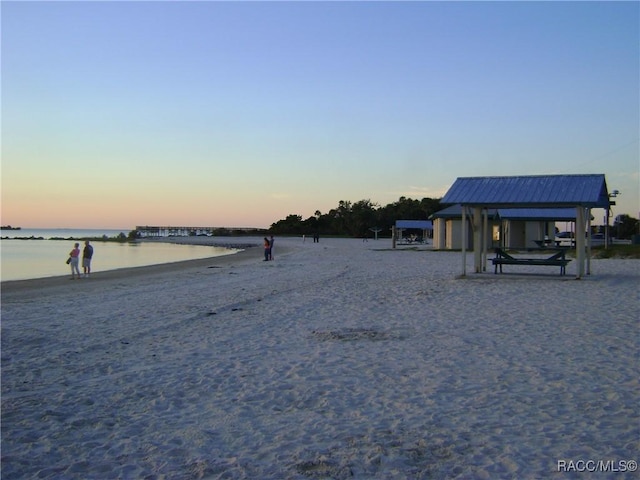 property view of water featuring a gazebo and a view of the beach