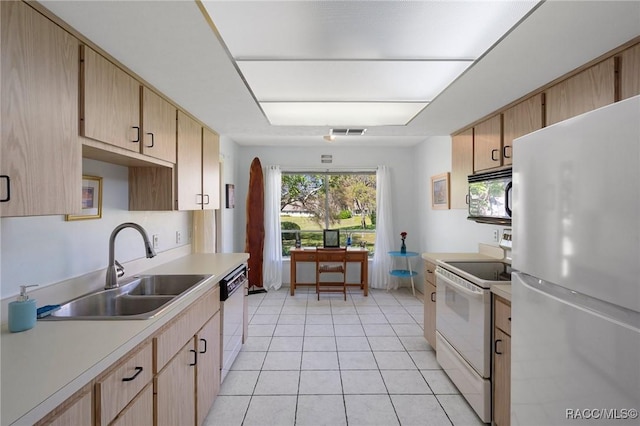 kitchen with white appliances, light brown cabinets, visible vents, a sink, and light countertops