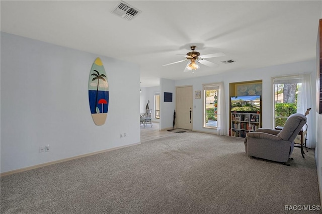 unfurnished room with a ceiling fan, baseboards, visible vents, and carpet floors