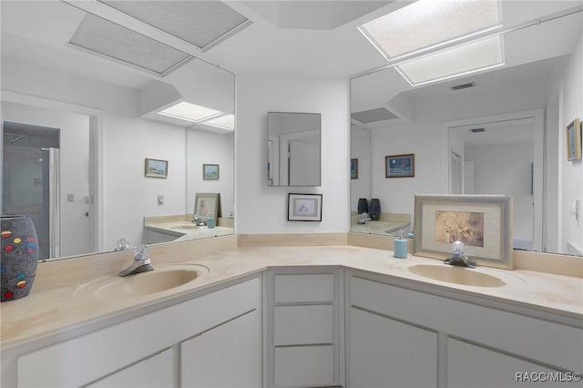 full bathroom with vanity and visible vents