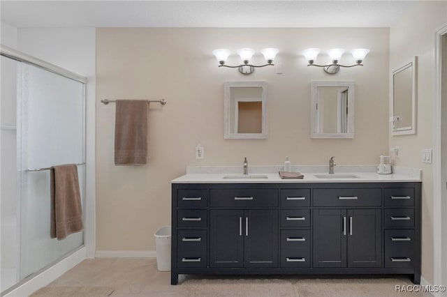 bathroom with tile patterned flooring, vanity, and a shower with shower door