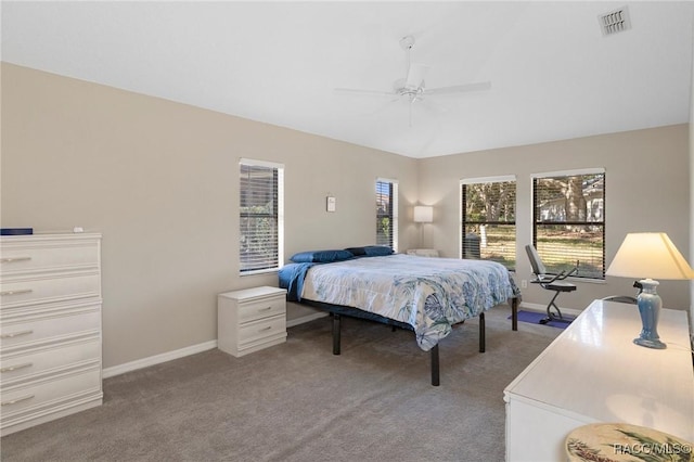 bedroom featuring ceiling fan and carpet